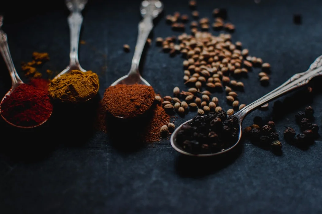 Aromatic Indo-Chinese spices on spoons